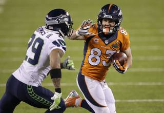 Denver Broncos' Wes Welker (83) runs against Seattle Seahawks' Earl Thomas during the second half of the NFL Super Bowl XLVIII football game Sunday, Feb. 2, 2014, in East Rutherford, N.J. (AP Photo/Chris O'Meara)