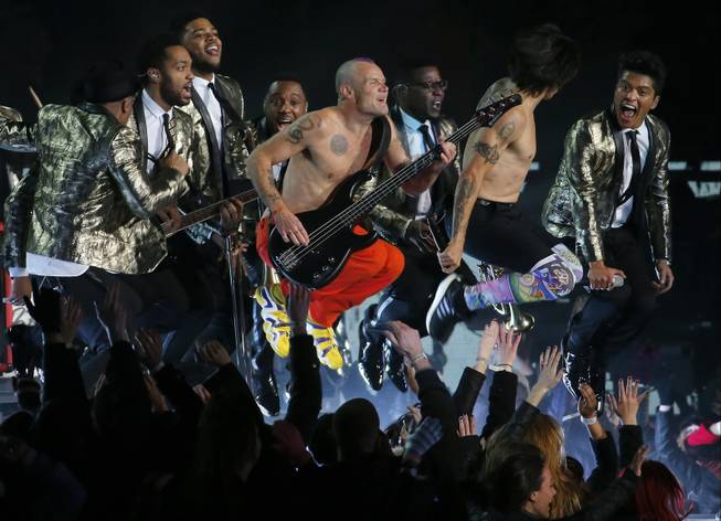 The Red Hot Chili Peppers and Bruno Mars, far right, perform during the Pepsi Super Bowl XLVIII Halftime Show on Sunday, Feb. 2, 2014, in East Rutherford, N.J. The Seattle Seahawks and the Denver Broncos are playing in the Super Bowl at MetLife Stadium. 