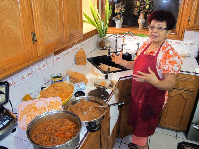 Hilda Vasquez makes tamales in her kitchen in Edinburg, Texas, on Wednesday, Dec. 4, 2013. Vasquez raised the $680 for her U.S. citizenship application by selling homemade tamales at South Texas offices.