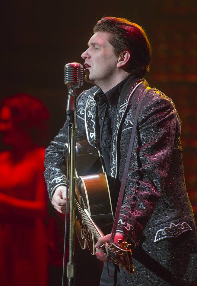 Benjamin Hale performs as Johnny Cash in "Million Dollar Quartet" at Harrah's Tuesday, Feb. 4, 2014.