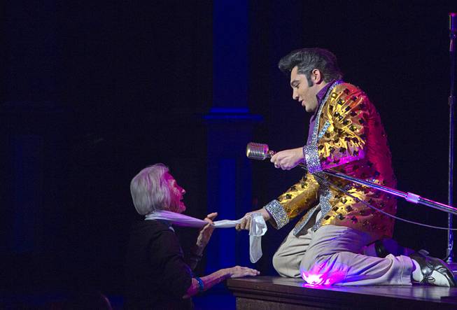 Justin Shandor as Elvis interacts with an audience member during "Million Dollar Quartet" at Harrah's Tuesday, Feb. 4, 2014.