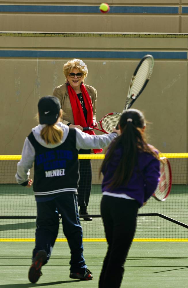 (from back) Las Vegas Mayor Carolyn G. Goodman joins Rocci Mendez, 8, and Natalie Cheong, 9, in a few volleys at the Darling Tennis Center on Tuesday, Feb. 04, 2014.  The mayor was on hand to announce the arrival of the Las Vegas Neon of the Mylan World Team Tennis here.