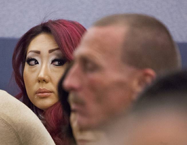 Gloria Lee, accused of arson and animal cruelty, in connection with a fire at her pet store, Prince and Princess Pet Boutique, appears in court Wednesday, Feb. 5, 2014. 