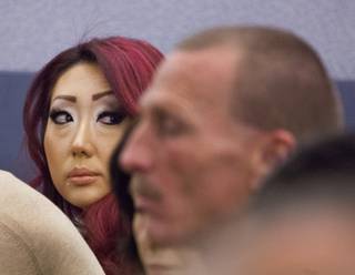 Gloria Lee, accused of arson and animal cruelty in connection with a fire at her pet store, Prince and Princess Pet Boutique, appears in court Wednesday, Feb. 5, 2014.
