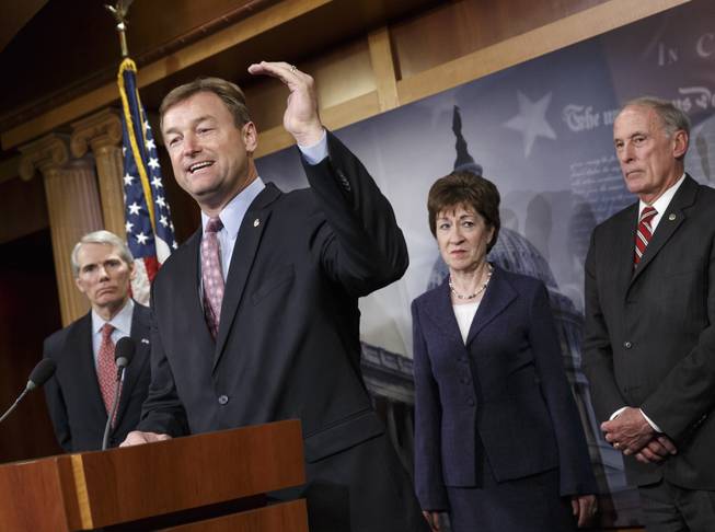 Sen. Dean Heller, R-Nev., second from left, accompanied by fellow Senate Republicans, gestures during a news conference on Capitol Hill in Washington, Tuesday, Jan. 14, 2014, where they discussed benefits to long-term jobless workers. From left are Sen. Rob Portman, R-Ohio, Heller, Sen. Susan Collins, R-Maine, and Sen. Dan Coats, R-Ind.