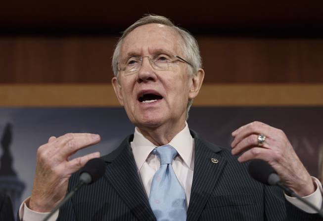 Senate Majority Leader Harry Reid, D-Nev., tells reporters that Republicans are thwarting Democratic efforts pass a bill to extend unemployment benefits which expired at the end of last year, at the Capitol in Washington, Thursday, Feb. 6, 2014.