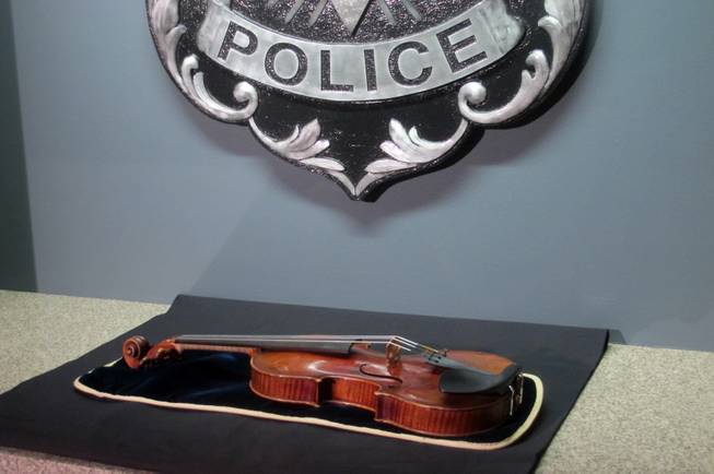 A $5 million Stradivarius violin is displayed at the Milwaukee Police Department Thursday, Feb. 6, 2014, in Milwaukee, a day after police recovered the instrument, which was stolen on Jan. 27 from a concertmaster in a parking lot by a person wielding a stun gun.