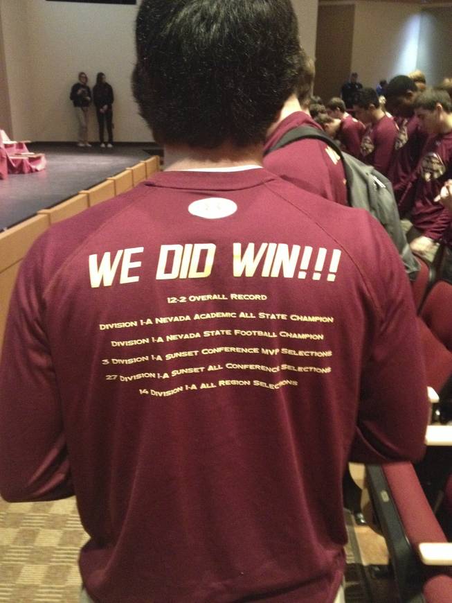Faith Lutheran football players received this shirt documenting their achievements in 2013.