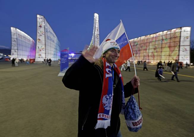 Fans make their way to Fisht Stadium for the opening ceremony of the 2014 Winter Olympics in Sochi, Russia, Friday, Feb. 7, 2014.