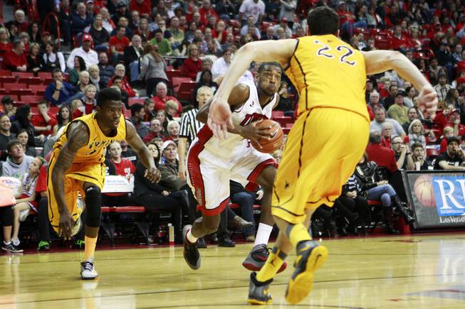 UNLV forward Roscoe Smith makes his move towards the basket against Wyoming during their game Saturday, Feb. 8, 2014 at the Thomas & Mack Center.