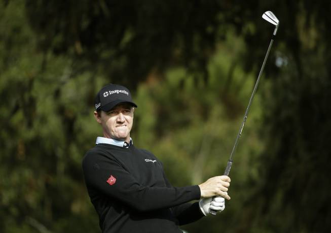 Jimmy Walker follows his shot off the third tee Saturday, Feb. 8, 2014, during the third round of the AT&T Pebble Beach Pro-Am golf tournament on the Monterey Peninsula Country Club Shore Course in Pebble Beach, Calif. 