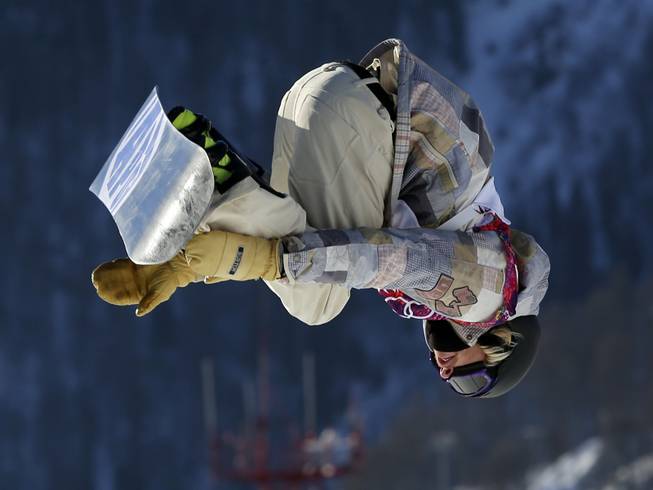 United States' Sage Kotsenburg takes a jump during the men's snowboard slopestyle semifinal at the Rosa Khutor Extreme Park, at the 2014 Winter Olympics, Saturday, Feb. 8, 2014, in Krasnaya Polyana, Russia. 
