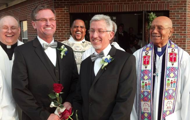 From left, the Rev. Kevin Higgs, Bobby Prince, the Rev. J.R. Finney, Joe Openshaw and retired Bishop Melvin Talbert stand together after Talbert officiated Prince and Openshaw's wedding in Birmingham, Ala., on Oct. 26, 2014. The Council of Bishops has called for a formal complaint against Talbert, who presided at the wedding over the objections of a local bishop.