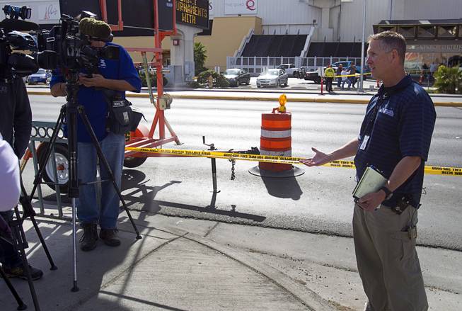 Metro Police Sgt. Richard Strader talks to reporters after an auto pedestrian accident at Flamingo Road and Linq Lane (between Koval Lane and the Las Vegas Strip) Tuesday Feb. 11, 2014.