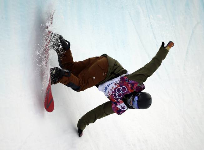 Switzerland's David Habluetzel competes during the men's snowboard halfpipe qualifying at the Rosa Khutor Extreme Park, at the 2014 Winter Olympics, Tuesday, Feb. 11, 2014, in Krasnaya Polyana, Russia. 