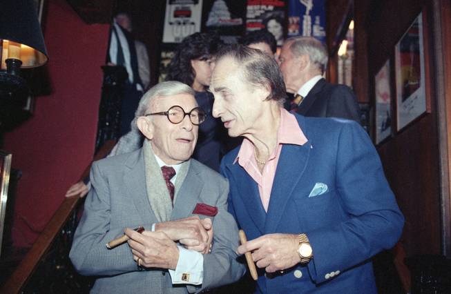 Sid Caesar, right, poses with George Burns during a party at Sardi?s in New York Wednesday, Nov. 2, 1989, celebrating the opening of Caesar's Broadway play "Sid Caesar & Company: Does Anybody Know What I'm Talking About." 
