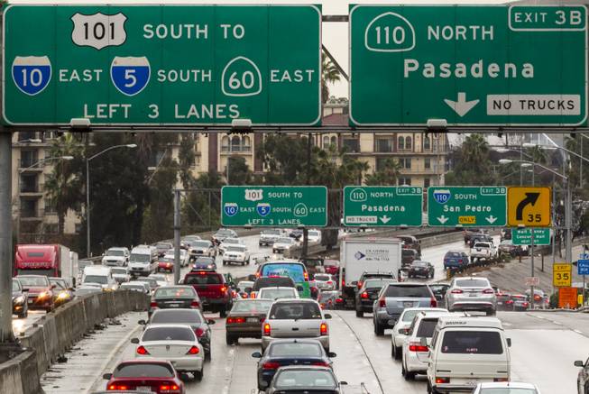 In this Thursday, Feb. 6, 2014, photo, traffic on the eastbound Hollywood Freeway approaches the four-level interchange in downtown Los Angeles. A California Department of Transportation report ranks Interstate 5 in Los Angeles County as the most congested highway in the state.