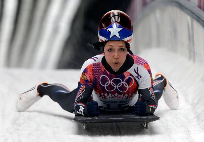 Katie Uhlaender of the United States brakes after her final run during the women's skeleton competition at the 2014 Winter Olympics, Friday, Feb. 14, 2014, in Krasnaya Polyana, Russia.