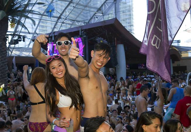 Crysta Imahara, Kevin Johnsonand Rainer Gonzalez attend the Halfway to EDC and first winter pool party at Marquee Dayclub on Sunday, Feb. 16, 2014, in the Cosmopolitan of Las Vegas.