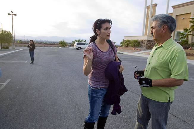 Shannon Forsythe, executive director of Run 2 Rescue, gets directions from Benjamin Gonzalez, a maintenance man at East Vegas Christian Center, Monday, Feb. 17, 2014. Forsythe and Mary Borchers, left are looking for information on Jessie Foster, a Canadian, who went missing in 2006. She had been living in North Las Vegas.
