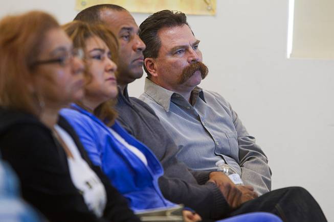 Pastor Troy  Martinez, right, listens to a morning briefing about missing woman Jessie Foster at East Vegas Christian Center Monday, Feb. 17, 2014. A new search is going on for Foster, a Canadian, who went missing in 2006. She had been living in North Las Vegas.