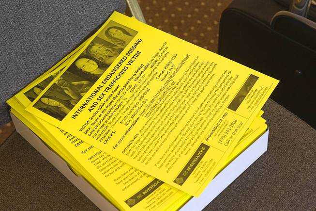 Stacks of fliers on Jessie Foster are shown at East Vegas Christian Center during a morning briefing for volunteers Monday, Feb. 17, 2014.  A new search is going on for Foster, a Canadian, who went missing in 2006. She had been living in North Las Vegas.