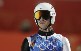 United States' Nicholas Alexander sports a mustache-shaped American flag painted in his face during the ski jumping large hill team competition at the 2014 Winter Olympics, Monday, Feb. 17, 2014, in Krasnaya Polyana, Russia.