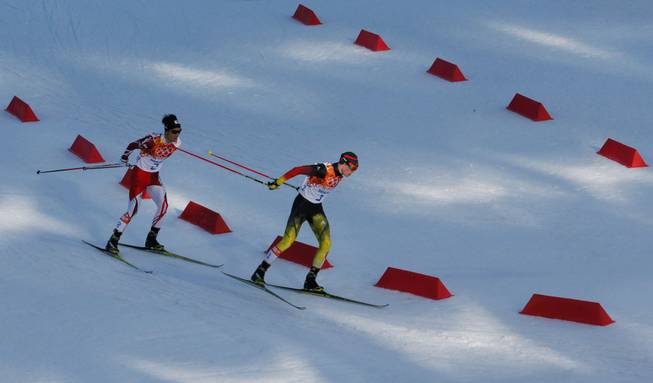 Germany's gold medal winner Eric Frenzel, right, and Japan's silver medal winner Akito Watabe ski during the cross-country portion of the Nordic combined at the 2014 Winter Olympics, Wednesday, Feb. 12, 2014, in Krasnaya Polyana, Russia.