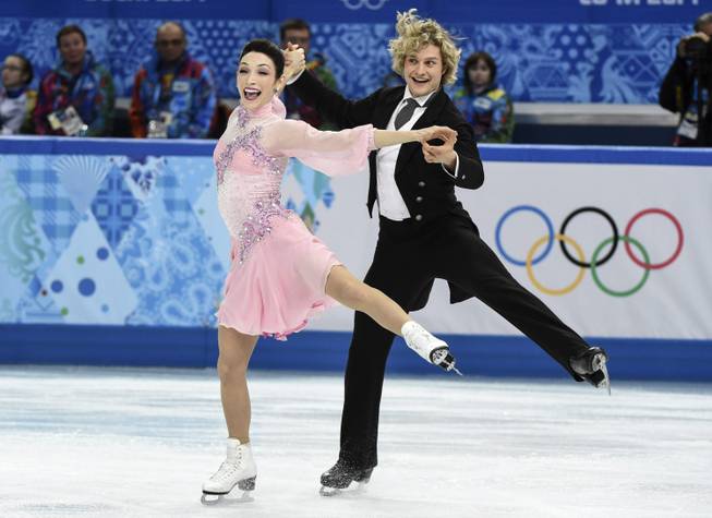 Meryl Davis, left, and Charlie White, of the United States, compete in the ice dance short dance figure skating competition at the Iceberg Skating Palace during the Winter Olympics, Sunday, Feb. 16, 2014, in Sochi, Russia.