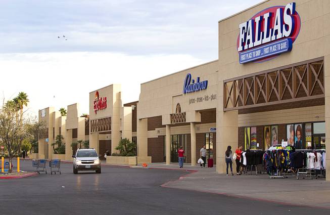 Shoppers look over clothing at a shopping center on East Tropicana Avenue near Pecos Road Tuesday, Feb. 18, 2014. The shopping center had been decline during the recession but is now recovering and adding tenants.