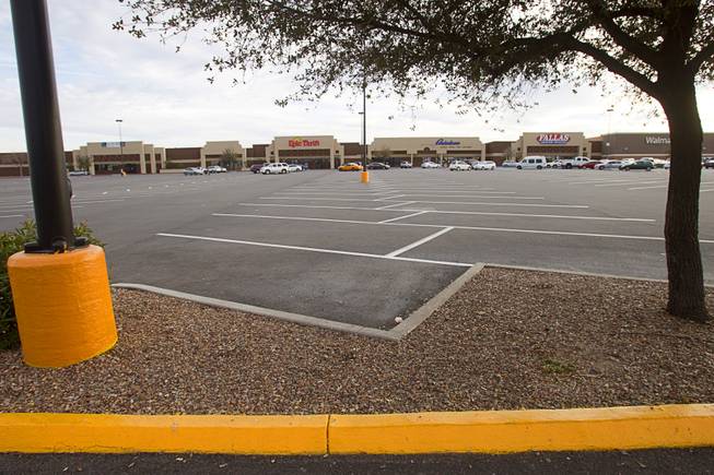 A view of a shopping center parking lot on East Tropicana Avenue near Pecos Road Tuesday, Feb. 18, 2014. The shopping center had been decline during the recession but is now recovering and adding tenants.