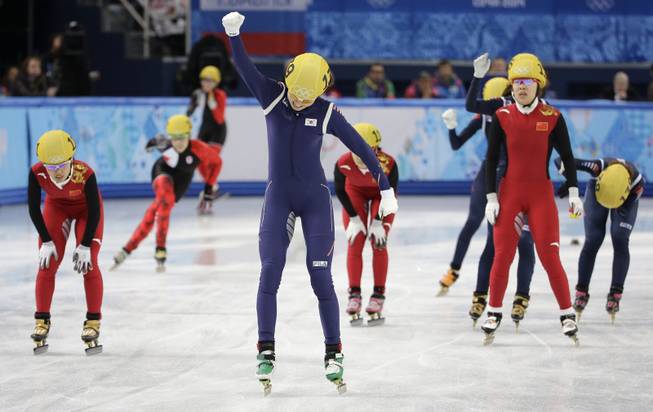 Shim Suk-Hee of South Korea, centre, celebrates her team's first place in the women's 3000m short track speedskating relay final at the Iceberg Skating Palace during the 2014 Winter Olympics, Tuesday, Feb. 18, 2014, in Sochi, Russia.