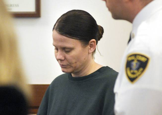 Julie Corey stands in Worcester, Mass., Superior Court on Tuesday, Feb. 18, 2014, where she was sentenced to life in prison for the 2009 murder of Darlene Haynes.
