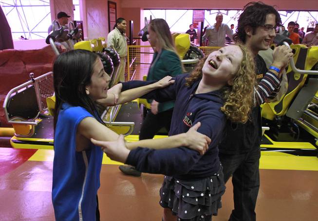 Benjamin de los Santos and Alayna McArthur react after being the first official riders of El Loco roller coaster at Circus Circus Tuesday, Feb. 18, 2014.