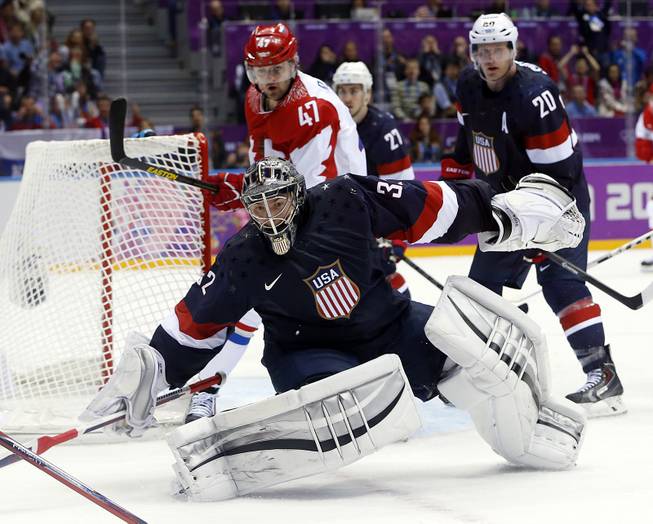 USA goaltender Jonathan Quick comes out of the crease to defend the goal in the third period of a men's ice hockey game at the 2014 Winter Olympics, Saturday, Feb. 15, 2014, in Sochi, Russia.