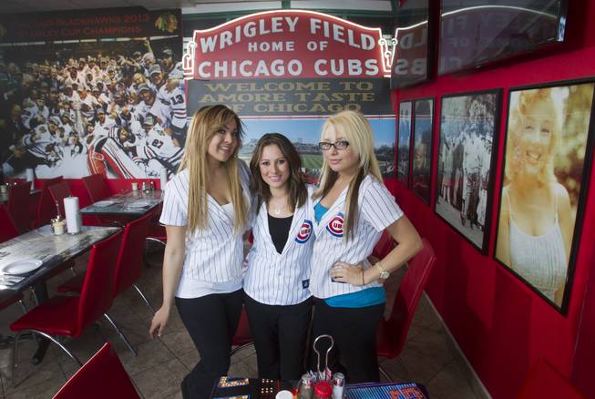 Servers, from left, Tiffany Shapouri, Susie Barajas, and Amanda Hewitt pose at Amore Taste of Chicago, 3945 S. Durango Dr., Wednesday, Feb. 19, 2014.
