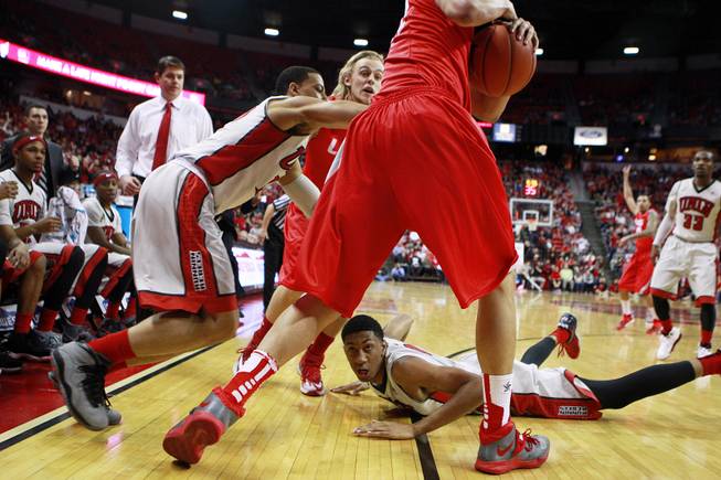 UNLV forward Chris Wood hits the floor after scrambling for a loose ball with New Mexico during their Mountain West Conference game Wednesday, Feb. 19, 2014 at the Thomas & Mack Center. New Mexico won the game 68-56.