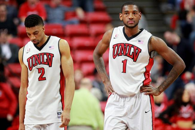 UNLV forwards Khem Birch and Roscoe Smith react during the final minutes of their game against New Mexico on Wednesday, Feb. 19, 2014, at the Thomas & Mack Center. New Mexico won 68-56.