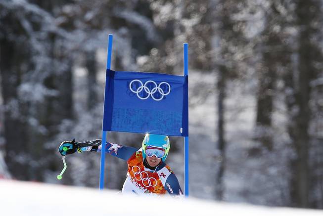 Gold medal winner Ted Ligety of the United States approaches a gate in the second run of the men's giant slalom the Sochi 2014 Winter Olympics, Wednesday, Feb. 19, 2014, in Krasnaya Polyana, Russia. 