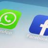 This Wednesday, Feb. 19, 2014, photo shows the WhatsApp and Facebook app icons on an iPhone.