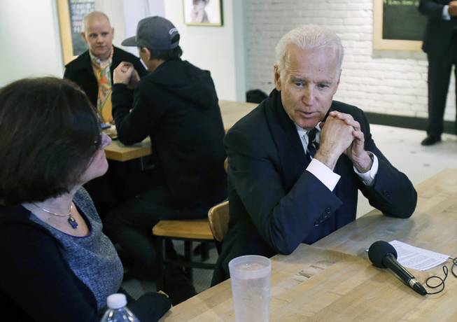 Vice President Joe Biden meets with women who have either signed up for coverage or have helped others sign up for insurance under the federal health care law during a stop at Moose and Sadie's coffee shop Wednesday, Feb. 19, 2014, in Minneapolis. 