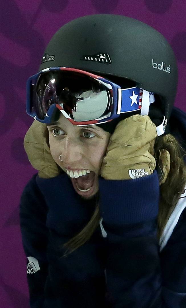 Gold medalist Maddie Bowman of the United States reacts after learning her score in the women's ski halfpipe at the Rosa Khutor Extreme Park, at the 2014 Winter Olympics, Thursday, Feb. 20, 2014, in Krasnaya Polyana, Russia. 