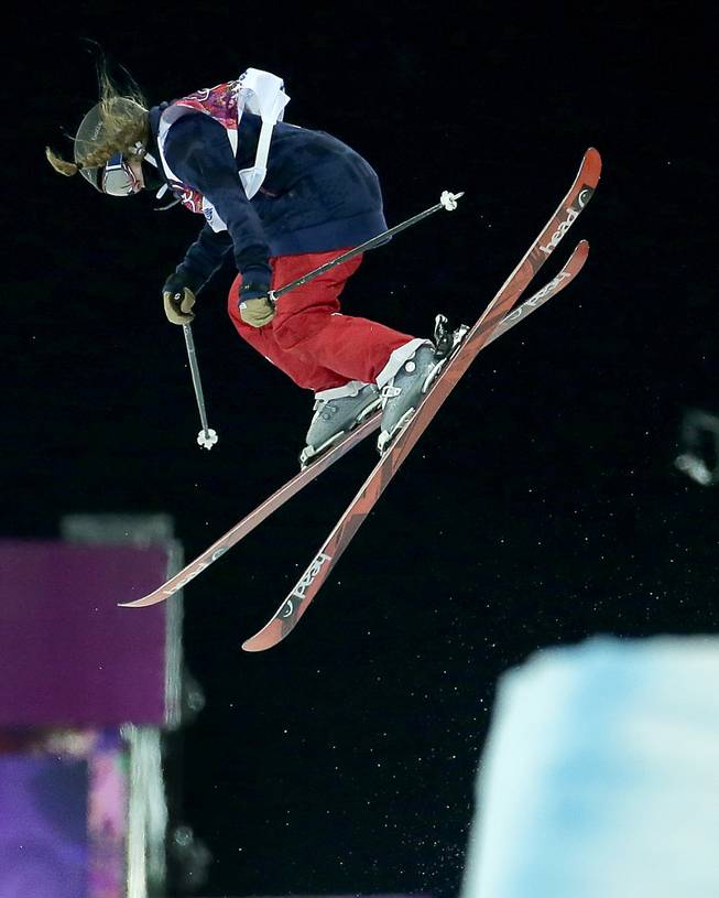 Gold medalist Maddie Bowman of the United States jumps in her final run in the women's ski halfpipe at the Rosa Khutor Extreme Park, at the 2014 Winter Olympics, Thursday, Feb. 20, 2014, in Krasnaya Polyana, Russia. 