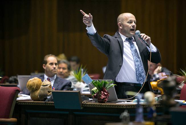 House Minority Leader Chad Campbell, D-Phoenix, argues that House Bill 2153 would discriminate against gays and others on the House floor in Phoenix on Thursday, Feb. 20, 2014.