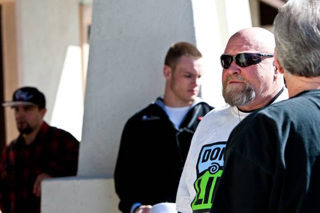 Don Brill and his son, Kevin (center) wait outside as people arrive for a ceremony celebrating the life of his younger son 16-year-old Aric Michael Brill, who donated six organs following his homicide five years ago, at the UMC Transplant Center Friday, February 21, 2014.