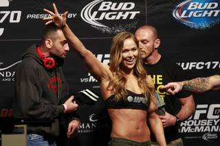 Bantamweight champion Ronda Rousey waves to fans during the weigh in for UFC 170 Friday, Feb. 21, 2014 at the Mandalay Bay Events Center in this file photo.