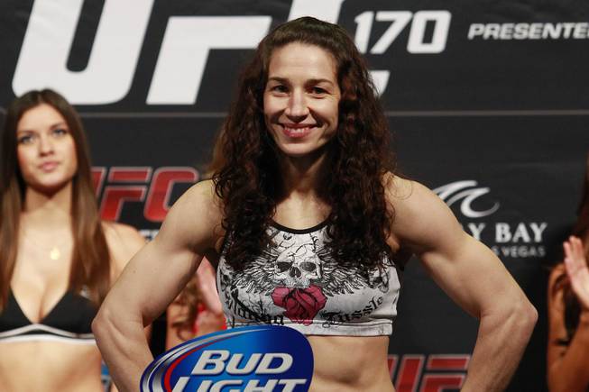 Bantamweight challenger Sara McMann smiles while making weight during the weigh in for UFC 170 Friday, Feb. 21, 2014 at the Mandalay Bay Events Center.