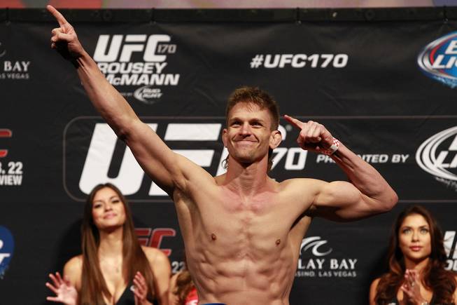 Mike Pyle poses after making weight during the weigh in for UFC 170 Friday, Feb. 21, 2014 at the Mandalay Bay Events Center.
