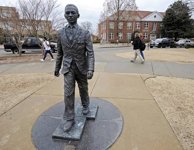 The James Meredith statue is seen on the University of Mississippi campus in Oxford, Miss., Monday, Feb. 17, 2014. A $25,000 reward is available for information leading to the arrest of two men involved in sullying the statue early Sunday, Feb. 16. 
