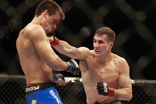 Rory MacDonald hits Demian Maia with a right during their fight at UFC 170 Saturday, Feb. 22, 2014 at the Mandalay Bay Events Center.